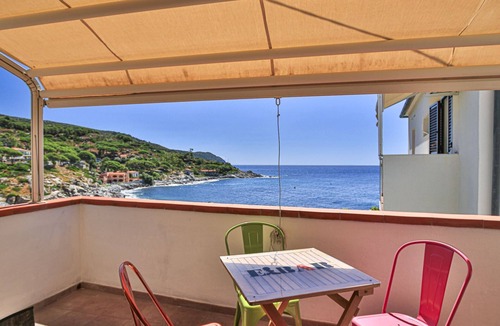 Seccheto Apartment | Camilla, a three-room apartment in Seccheto with a splendid sea view, a small balcony equipped with