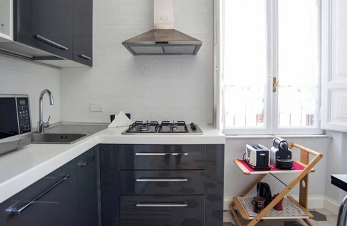 Rione VII Regola Apartment | Elegant Roman Apartment with Rooftop Access & Landmark Views