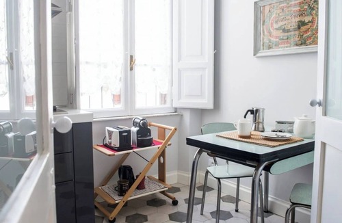 Rione VII Regola Apartment | Elegant Roman Apartment with Rooftop Access & Landmark Views