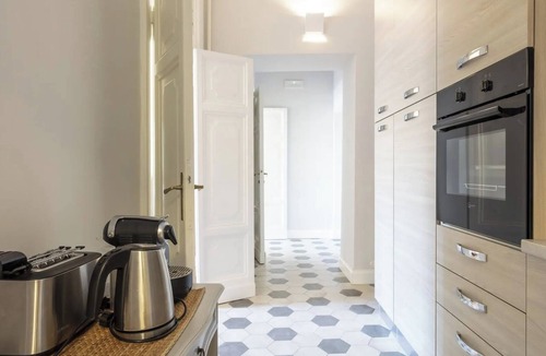 Rione VII Regola Apartment | Elegant Roman Apartment with Rooftop Access & Landmark Views