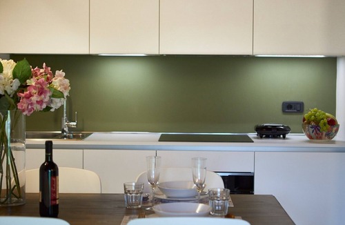 Riva del Garda Apartment | Elegant Top Floor Apartment "Salvia" with Mountain View & Balcony