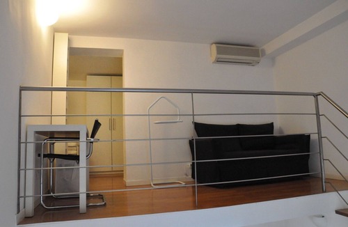 Rione XVIII Castro Pretorio Apartment | Rome: Sleeping space and living room - two levels between Repubbli