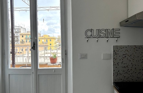 Tuscolano Apartment | Small attic with romantic terrace in the heart of Torpignattara.