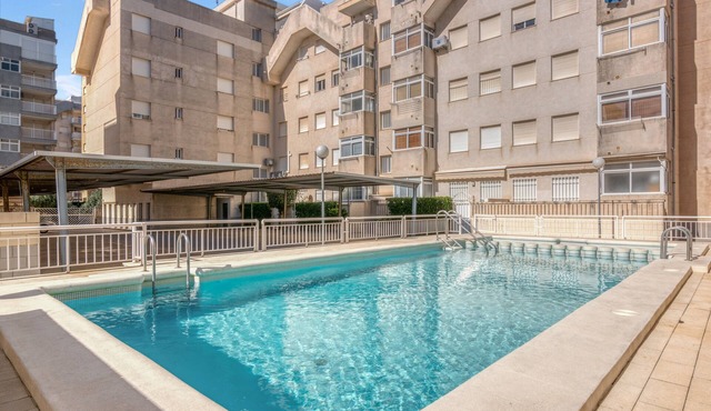 Apartment 'On Daimús Beach' with Shared Pool, Wi-Fi and Air Conditioning in Daimús
