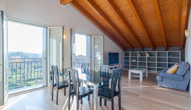 GuestHost - Travel with your family and friends and explore lakes and mountains near Como!This large attic, with two bedrooms, two bathrooms, open space kitchen with island, large living room, terraces and patio for relaxing, is located on the road that in Cesana Brianza