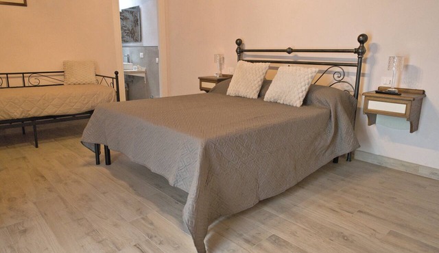Two-room apartment with 1 double bed, 1 single bed, and a kitchen