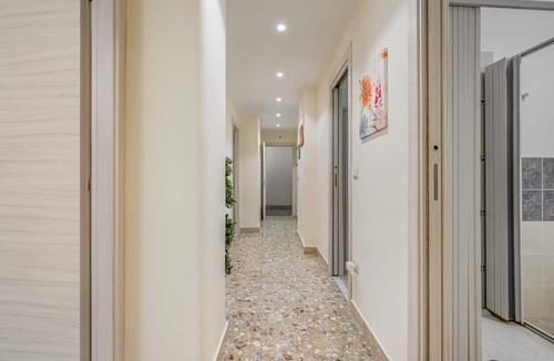 Borgo-Sanzio Apartment | GuestHost - Spacious 100 sqm apartment in Catania, ideal for 8 people, located on the second floor of a building with an elevator (not suitable for disabled individuals). The accommodation features two balconies and is near Villa Bellini, one of the city