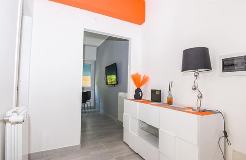 Ostiense Apartment | Vibrantly colored apartment on Salvatore Pincherle Street for 4 to four ospi